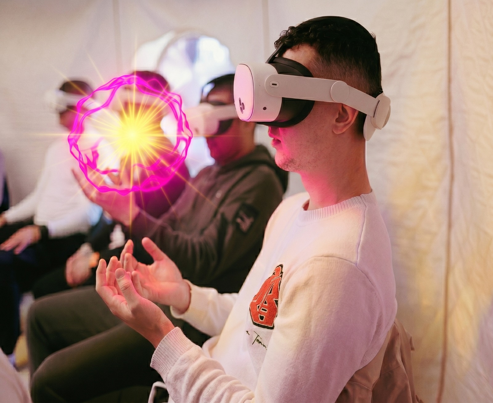 Person wearing Meta Quest headset holding a virtual sphere in mixed reality